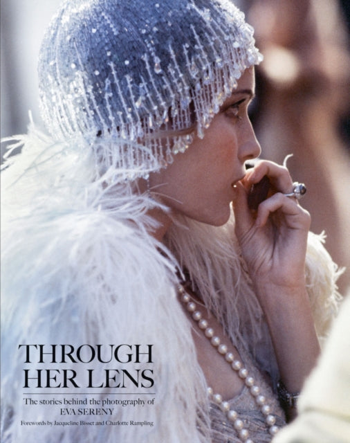 Book cover of: Through Her Lens. By: Iconic Images Eva Sereny